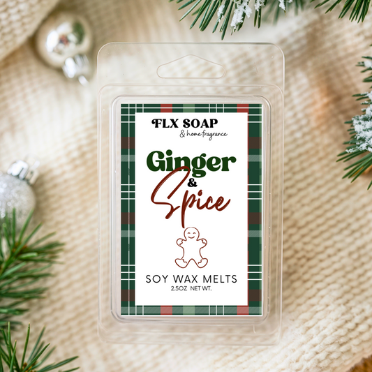 FLX SOAP Ginger & Spice soy wax melts packaging with Christmas decorations on a textured fabric background