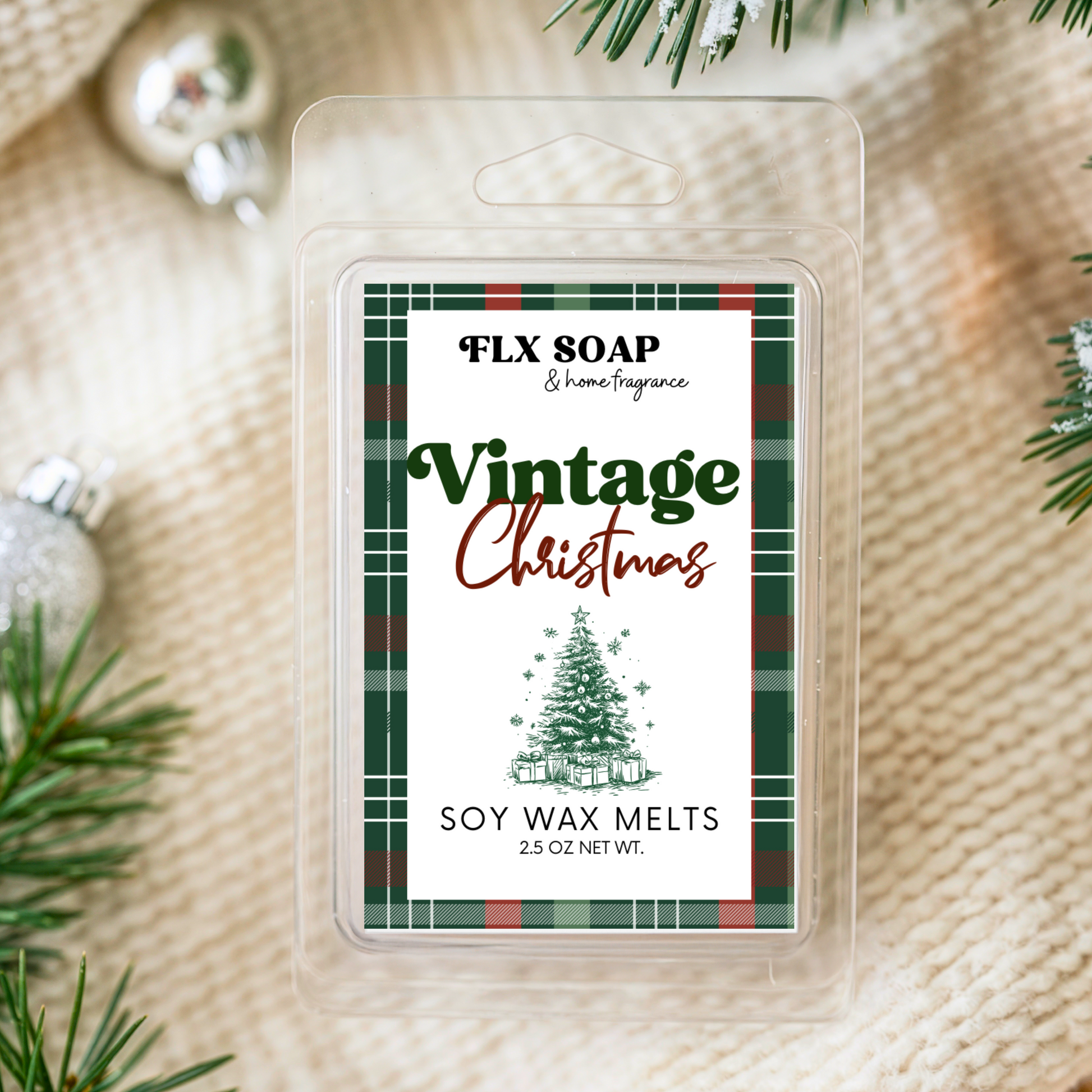 Pack of FLX Soap & Home Fragrance Vintage Christmas soy wax melts on a textured surface with Christmas decorations.